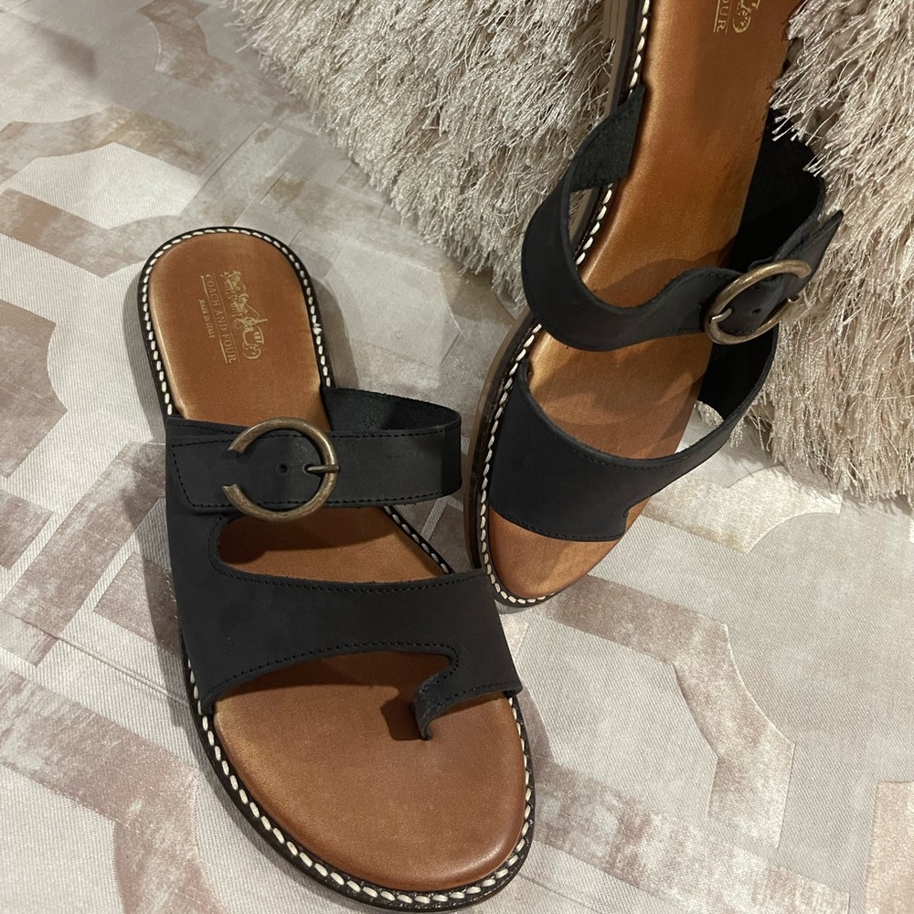 Coach leather sandals
Fits like size 10
Worn once-like new
